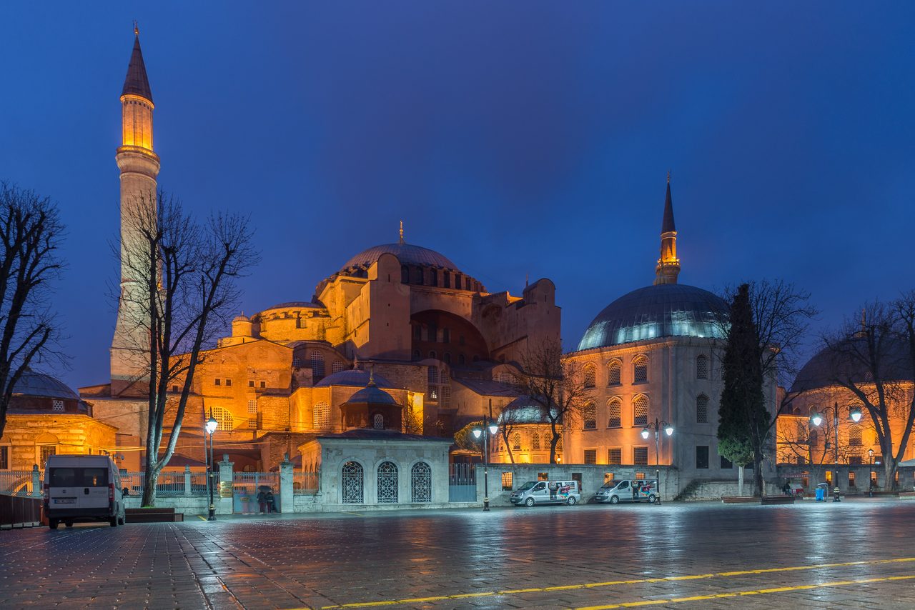 The exterior of Hagia Sophia in Istanbul, with its dome, buttresses and minarets.